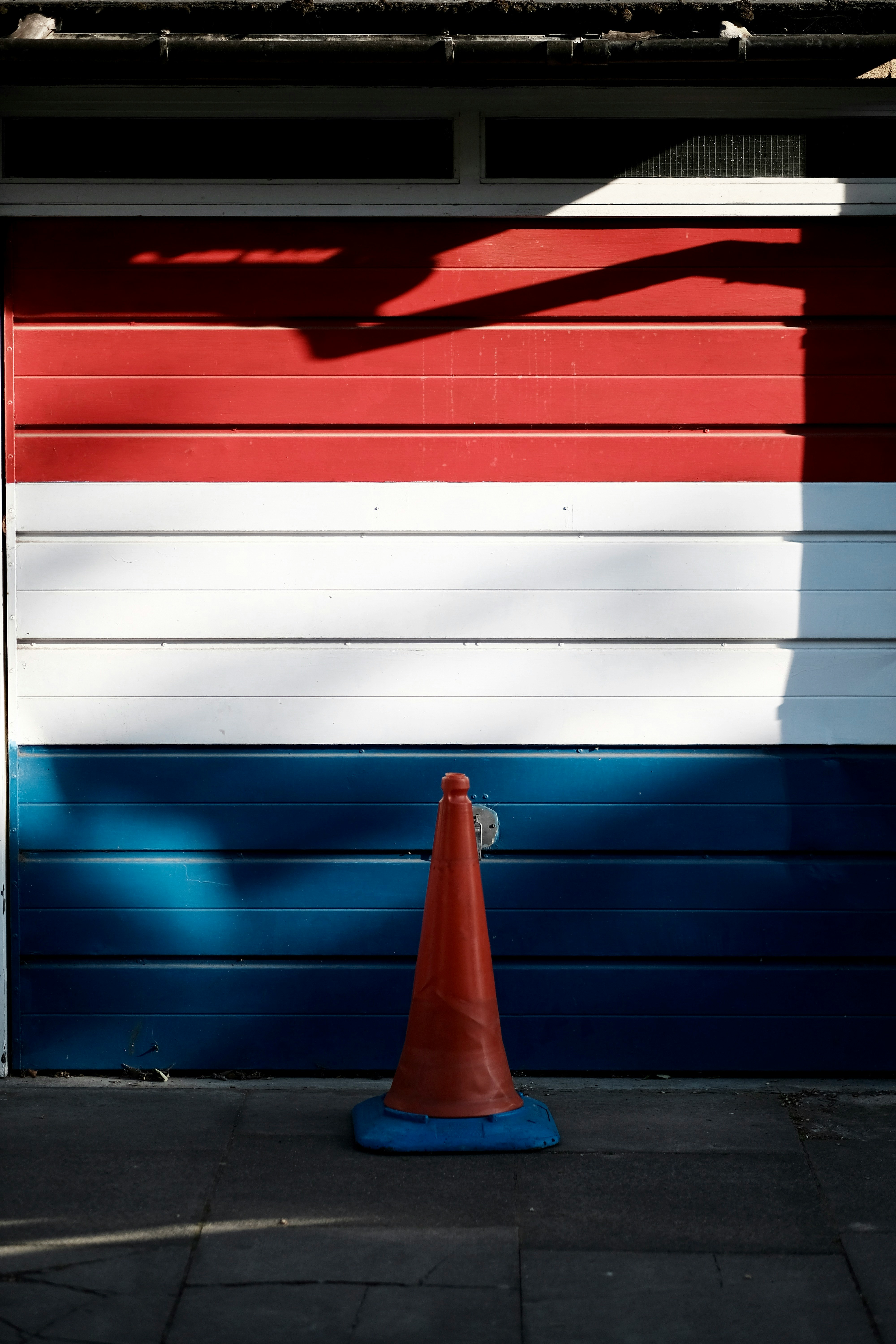 red, white , and blue wooden garage door